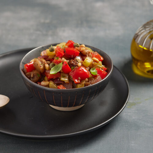 Sicilian caponata with eggplant, peppers, capers, olives and pine nuts